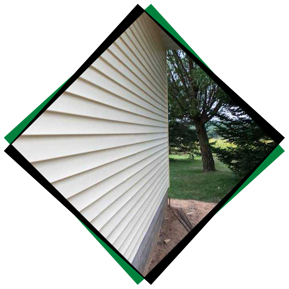 Yellowish vinyl siding being installed by Northwood Builders